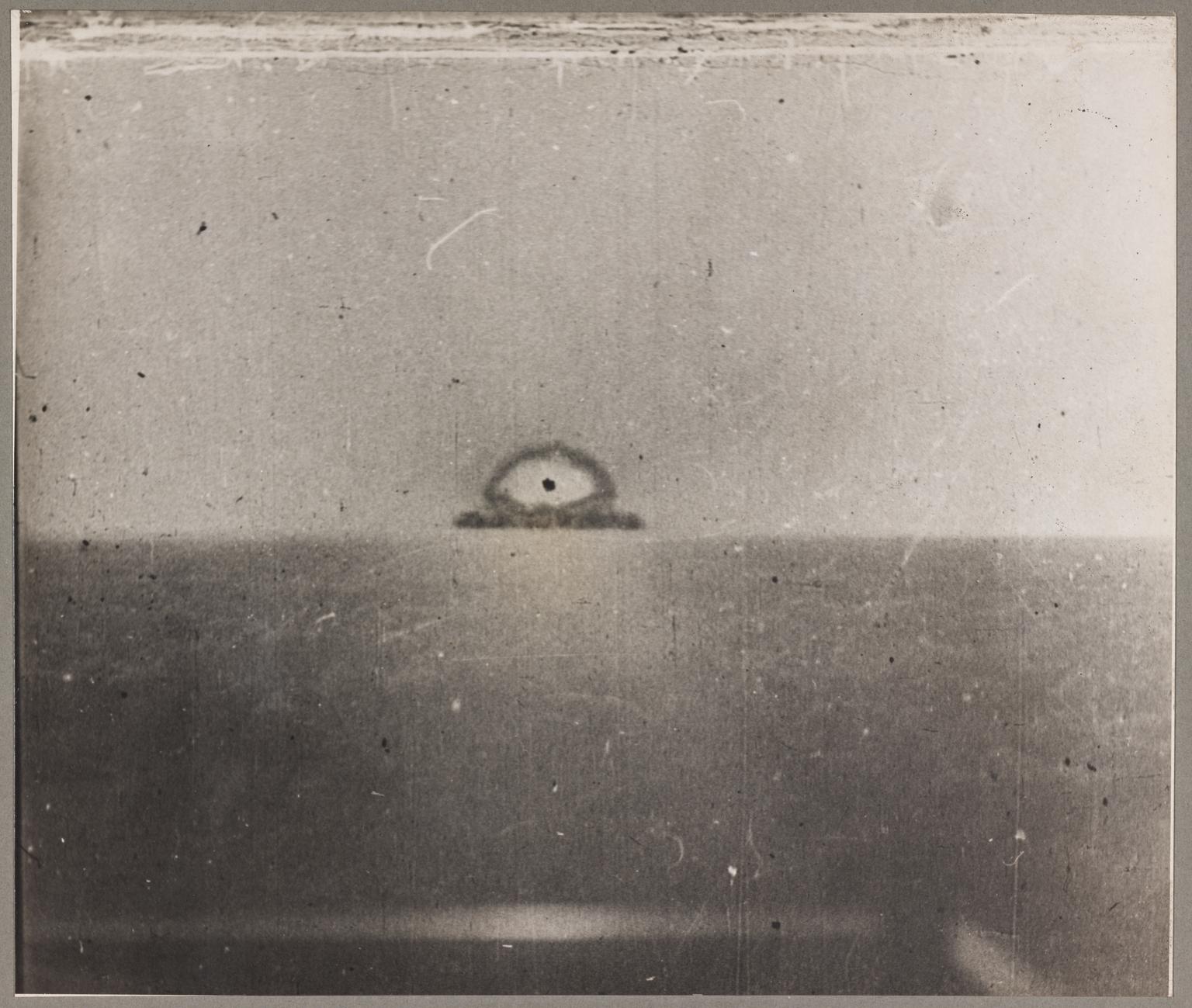 Black and white photographic print, 1st of 8, showing the July 1945 New Mexico atomic bomb explosion test